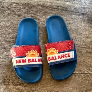 New Balance Blue and Red Kids' Slide Sandals with Sun Graphic